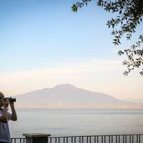 Photographer with mountain at background