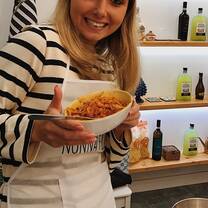 Woman holding a pasta bowl