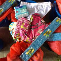Our health Kit: 3 reusable sanitary pads, 1 pack of disposable pads, knickers, soap, bucket