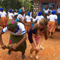 A student and a woman dancing together