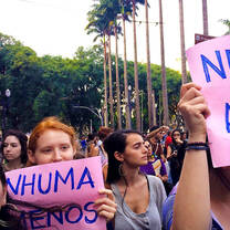 Protestors marching and holding signs 