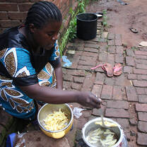 A woman cooking on the street