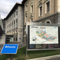 A map posted in front of buildings