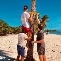 Our volunteers painting a sign on the beach