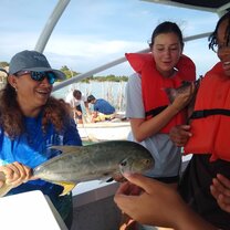 Student looking at fish 