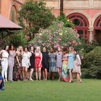 A group of fashion students posing for a photo during the welcome gala