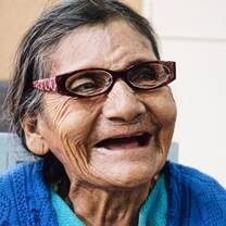 Elderly woman receives eye glasses