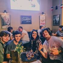 A group smiling around a table