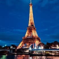 The Eiffel Tower lit up at night 