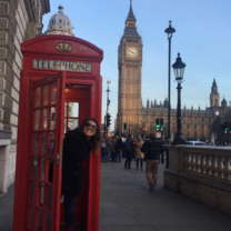 Intern in phonebooth in front of Big Ben 