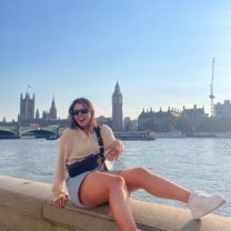 Intern laughing on a summer day along the Thames