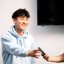 Happy student enjoying communications workshop