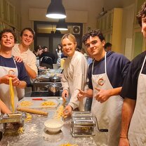A group of CET Florence students cooking pasta and sauce