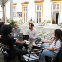 Students working at outside cafe