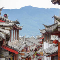 red buildings and roofs with mountain