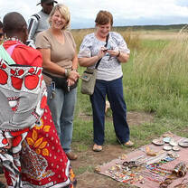 Tourist buying Maasai Cultural ornaments
