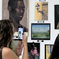 Student photographing other students artwork 