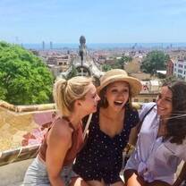 Girls laughing in park in Barcelona