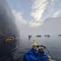 Kayaking through Misty Nordic Fjords