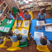 Kids drawing in a classroom 