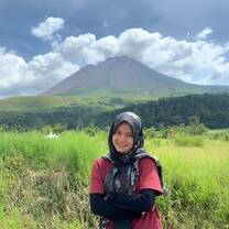 Our Program Leader standing in front of a volcano