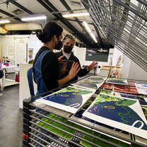 Student getting guidance from printing professor
