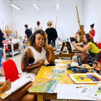 Students enjoying working on painting projects