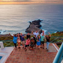 Adult students toasting with a view after a wine tasting