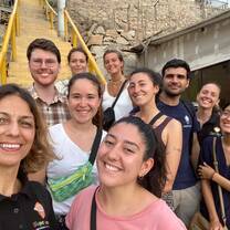 A group of volunteers in front of the classroom