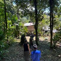Line of volunteers and community members doing a hike