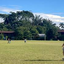 Center soccer field with volunteer throwing ball