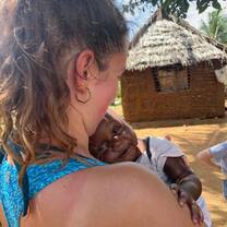 Girl holding small child