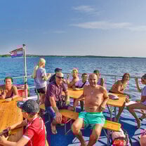 people smiling on boat