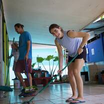 Girl sweeps community centre
