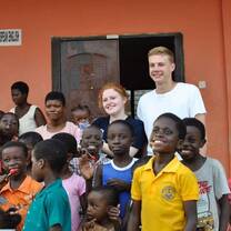 Our couple volunteers surrounded by smiles whilst they also give smiles