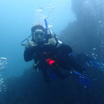 A diver poses for a photo 