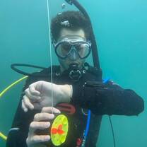 A diver checks the time 