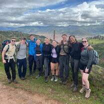 A group stands for a photo during a hike
