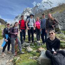 A group poses for a photo during a hike