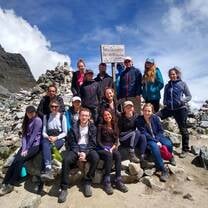 A group poses for a photo during a hike 