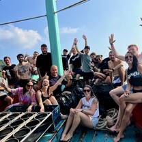 A group poses on a boat