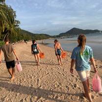a group helps clean the beach