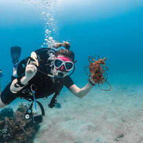 a diver poses for the camera