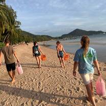 a group helps clean the beach