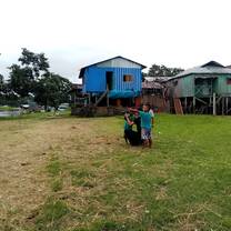 people standing in front of a house