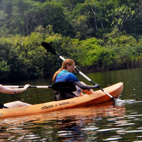 close up of girl paddling in a kayak