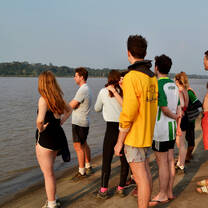 students standing on a beach