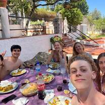 students eating paella in host house