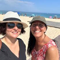 selfie of two women smiling on a beach