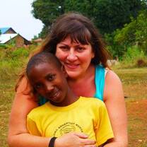woman hugging boy and smiling 